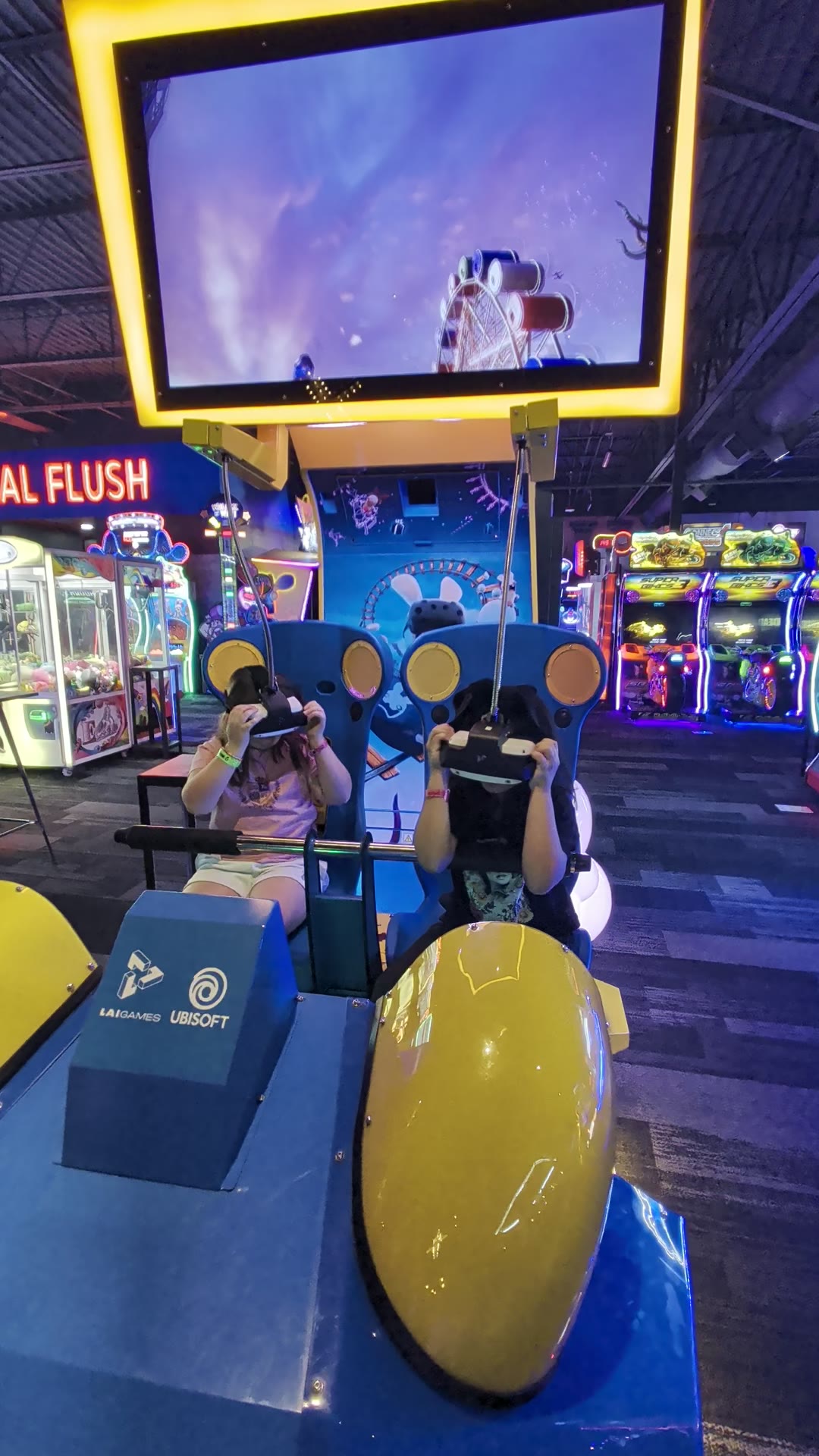 The VR coaster at Mavrix. Headsets on, hands up.