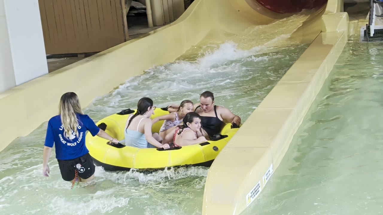 The raft coming off the slide — the splash was the point.